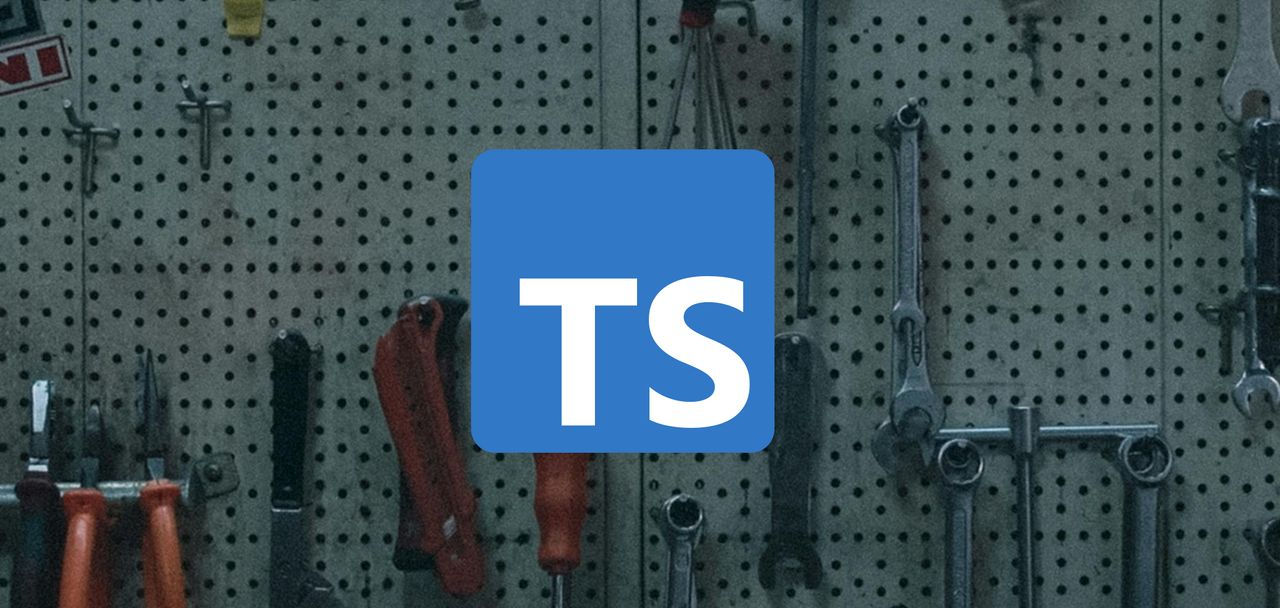 TypeScript logo with wrench and other tools in the background